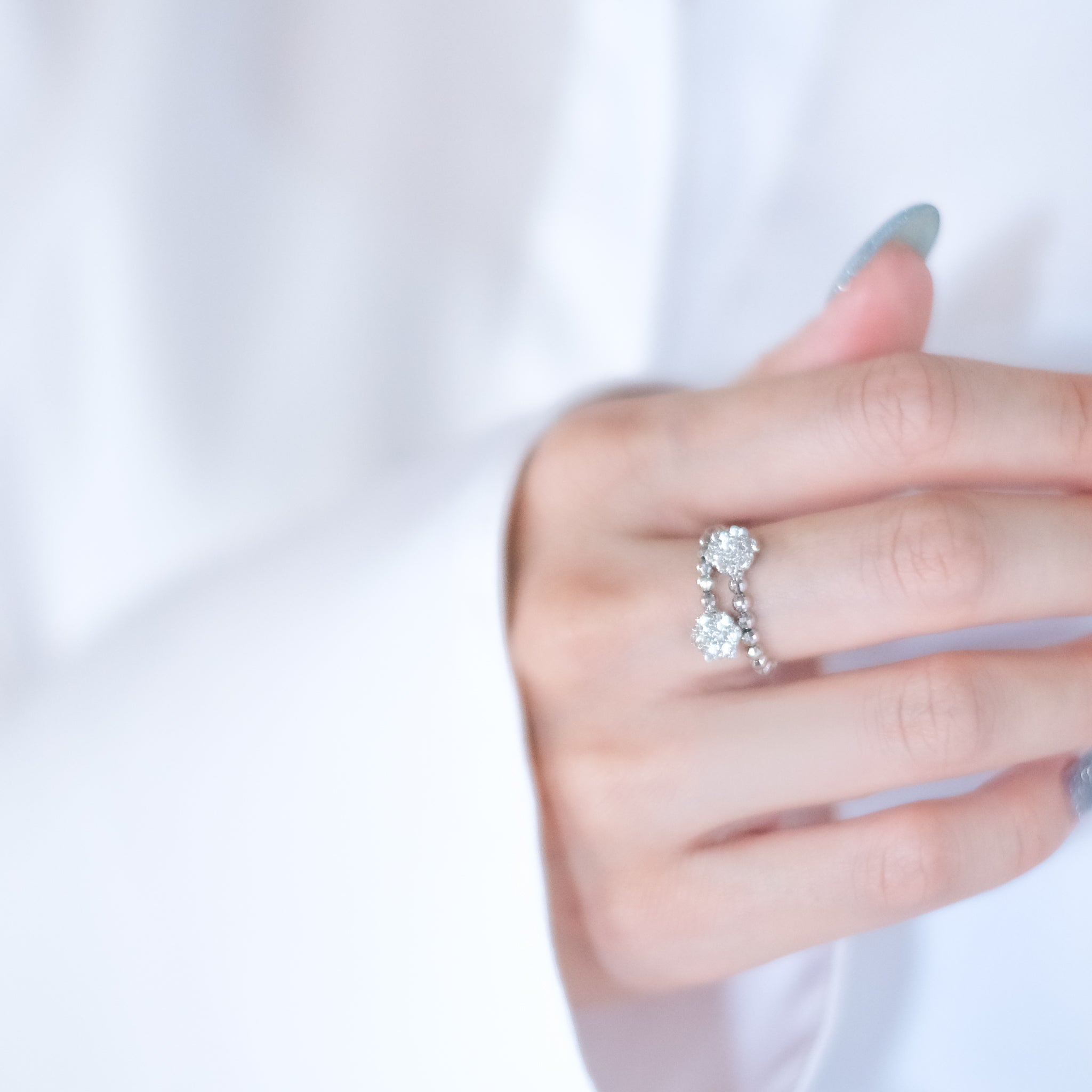 ダイヤモンド プラチナリング(フリーサイズ/フラワーモチーフ/4月誕生石)《26A01805》