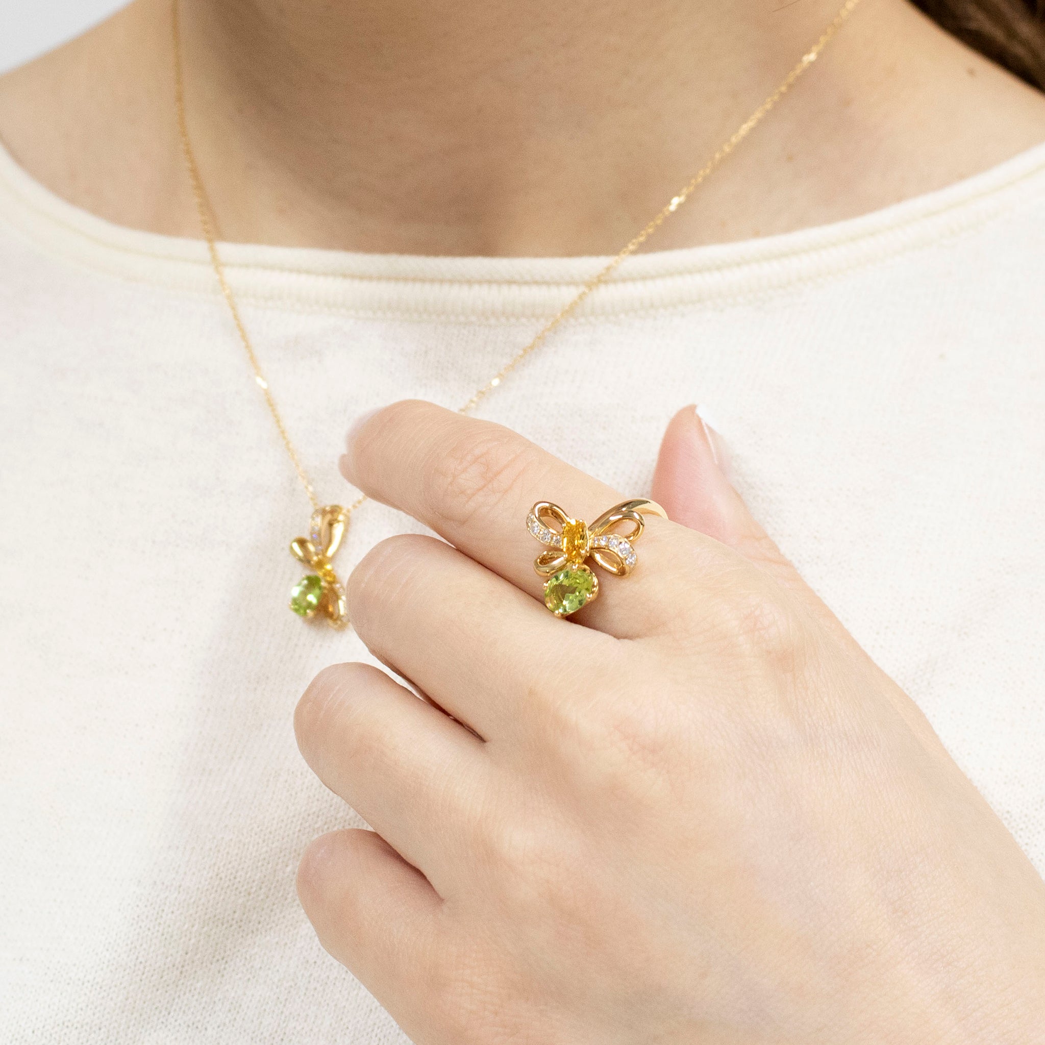 サファイア/ペリドット K18リング(NINA RICCI)《25V01004》